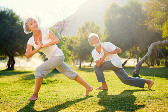 Mand-and-Woman-doing-yoga-outside