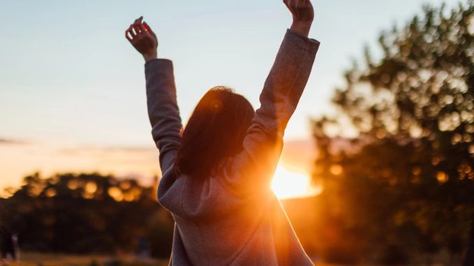 oung-woman-watching-sunset-while-enjoying-life-ezgif.com-webp-to-jpg-converter